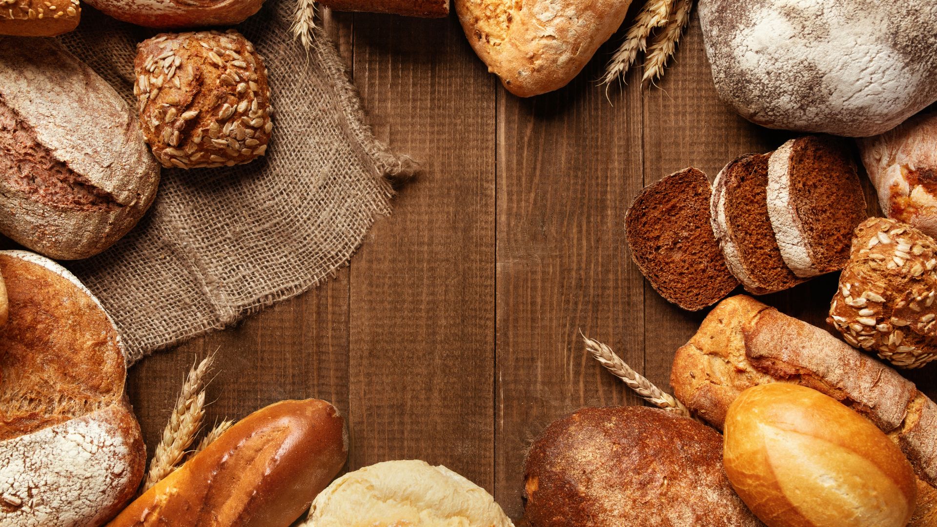 Various Bread and Baked Goods on Wooden Surface